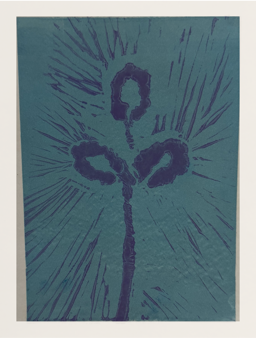 The finished linocut print, purple ink on teal paper, the stem reading as a figure with arms raised inside a radiating burst